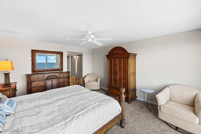 bedroom featuring ceiling fan and light colored carpet