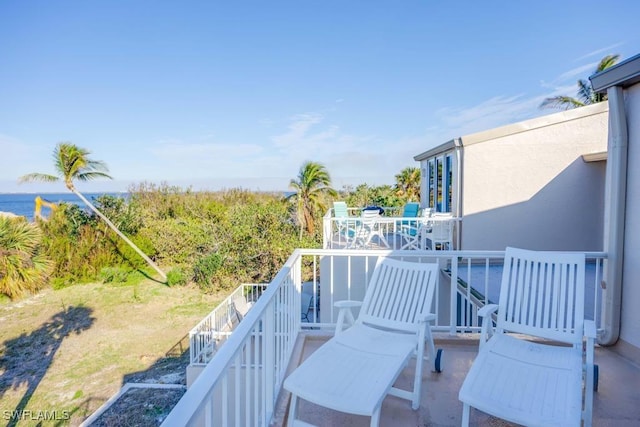 balcony featuring a water view