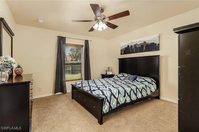 carpeted bedroom featuring ceiling fan