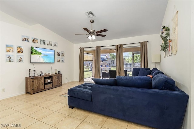 living room featuring ceiling fan, light tile patterned flooring, and vaulted ceiling