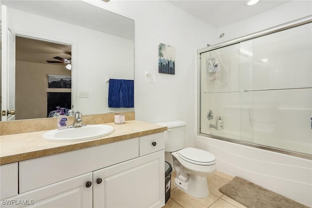 full bathroom with toilet, tile patterned floors, enclosed tub / shower combo, ceiling fan, and vanity