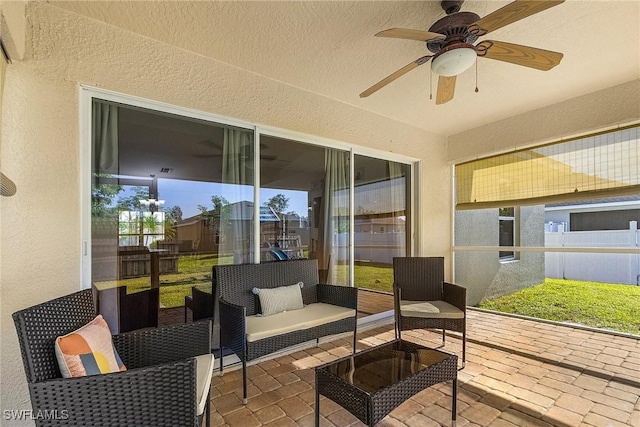 sunroom / solarium with ceiling fan