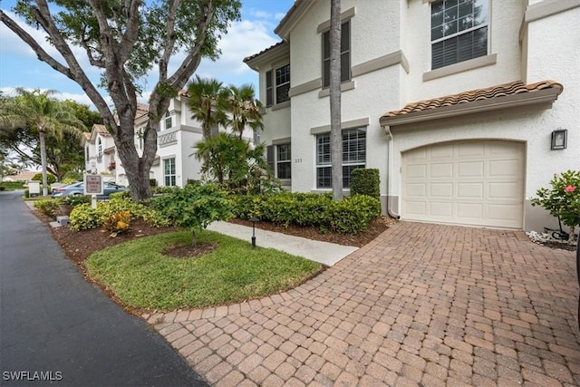 view of front of property with a garage