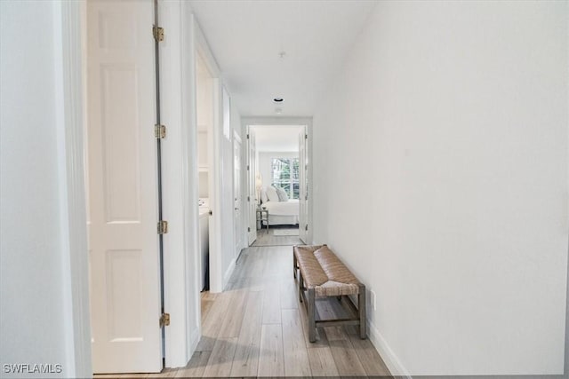 hall with light hardwood / wood-style floors