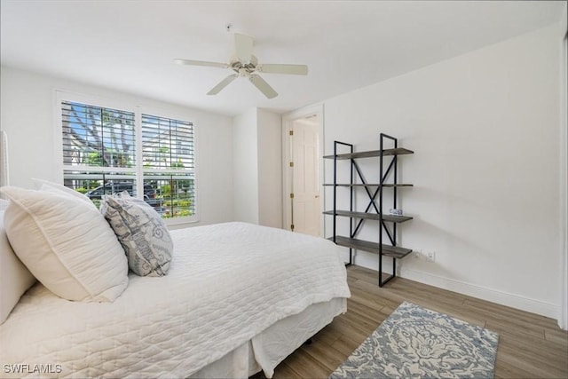 bedroom with hardwood / wood-style floors and ceiling fan