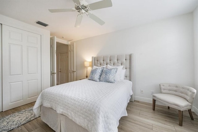 bedroom with ceiling fan and light hardwood / wood-style flooring