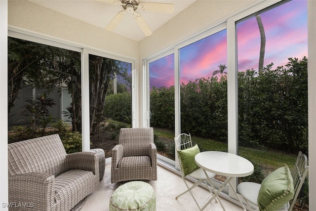 sunroom / solarium featuring ceiling fan