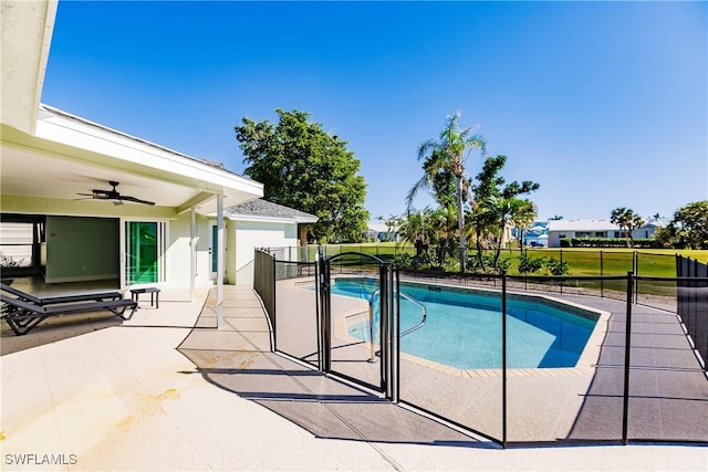 view of pool with a patio area and ceiling fan