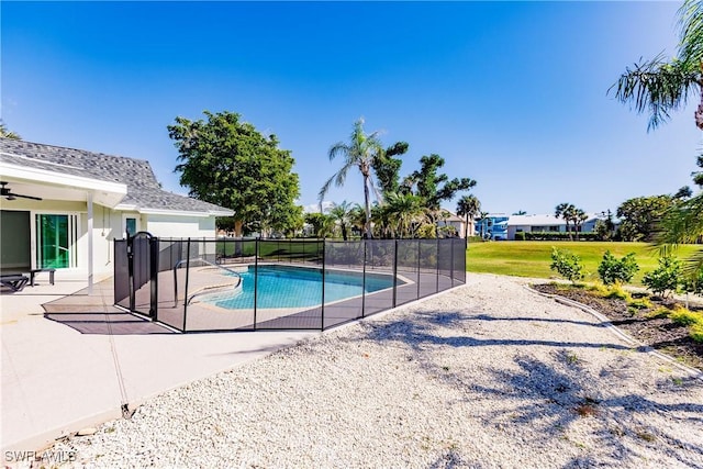 view of swimming pool with a patio and a lawn