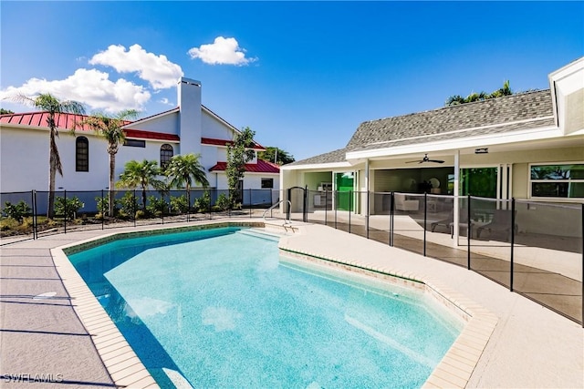 view of pool with ceiling fan and a patio