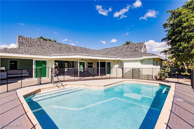 view of pool with ceiling fan and a patio