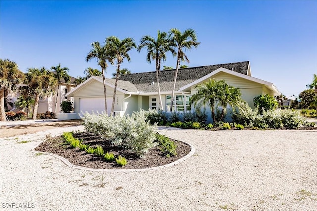 single story home featuring a garage