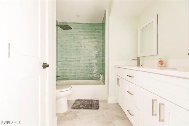 full bathroom featuring toilet, vanity, and tiled shower / bath combo