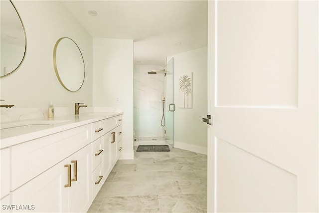 bathroom featuring vanity and a shower with shower door