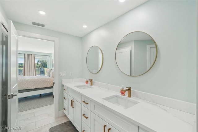 1298 Par View Dr, Sanibel, FL 33957 - bathroom with double vanity, connected bathroom, recessed lighting, and tile patterned flooring