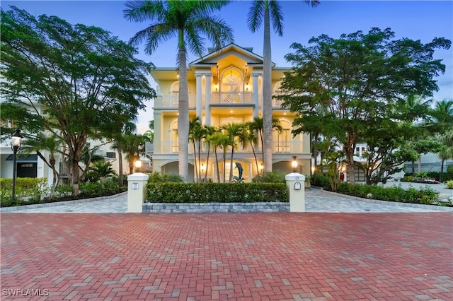 view of front of property with a balcony