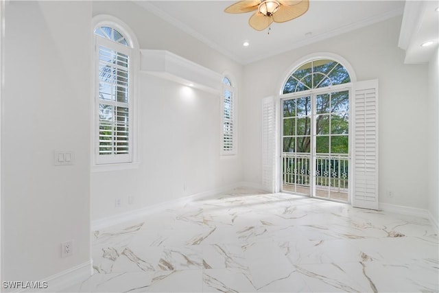 spare room with ceiling fan and crown molding