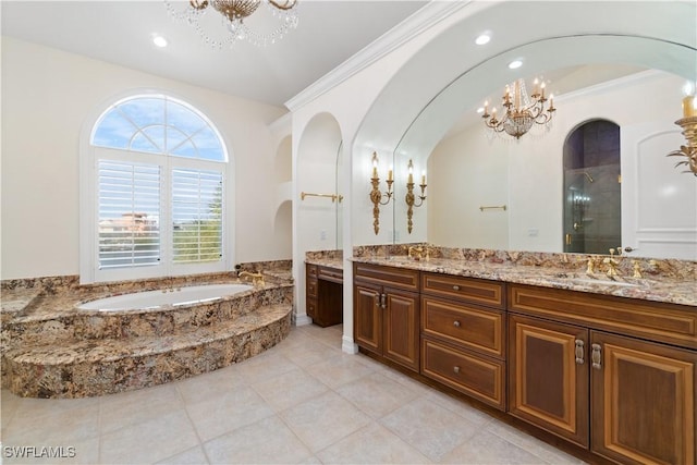 bathroom with vanity, an inviting chandelier, crown molding, and separate shower and tub