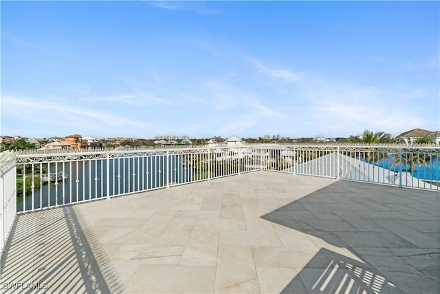 view of patio with a water view