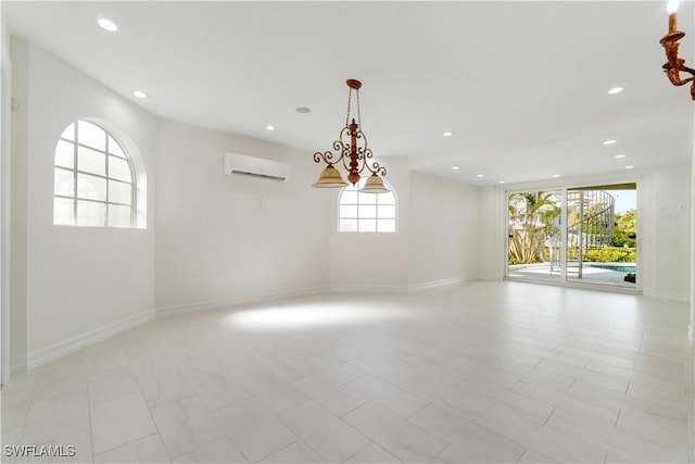 unfurnished room featuring light tile patterned floors, an AC wall unit, and plenty of natural light