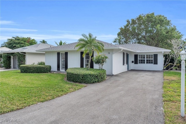 ranch-style home featuring a front yard