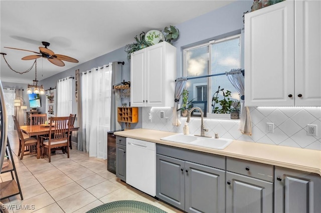 kitchen with white cabinets, gray cabinetry, ceiling fan, sink, and dishwasher