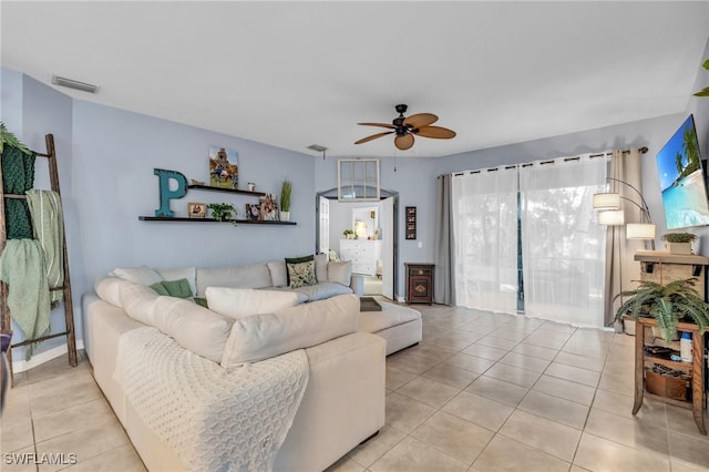 living room with light tile patterned floors and ceiling fan