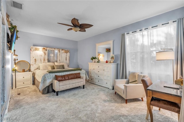 bedroom with ceiling fan and light colored carpet