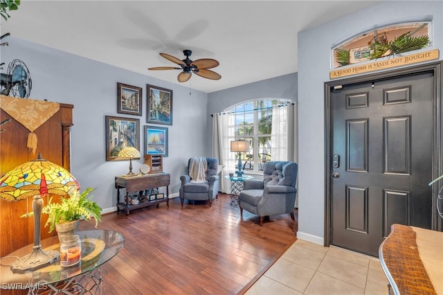 foyer featuring light hardwood / wood-style flooring and ceiling fan