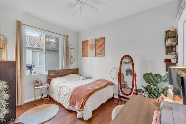 bedroom featuring hardwood / wood-style flooring and ceiling fan