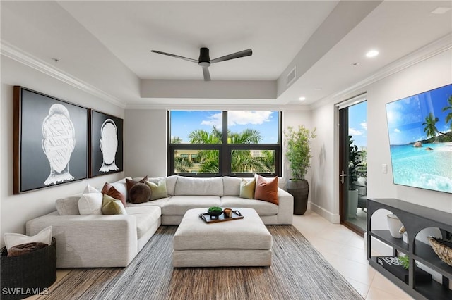 living room with ceiling fan and ornamental molding