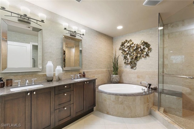 bathroom featuring tile patterned floors, separate shower and tub, and vanity