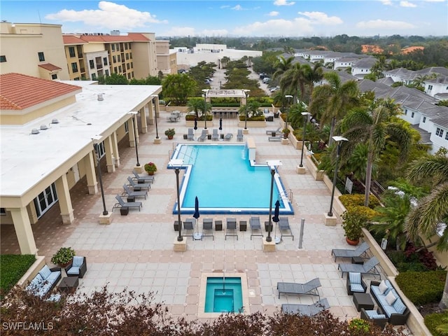 view of swimming pool featuring a patio area