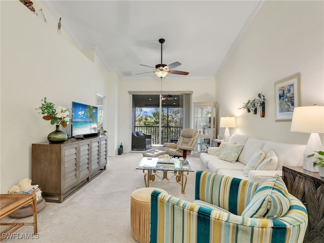 living room with light colored carpet, ceiling fan, and ornamental molding