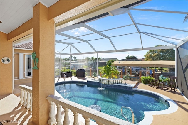 view of swimming pool featuring a lanai and a patio area