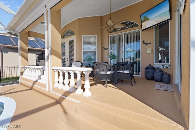 view of patio / terrace featuring ceiling fan