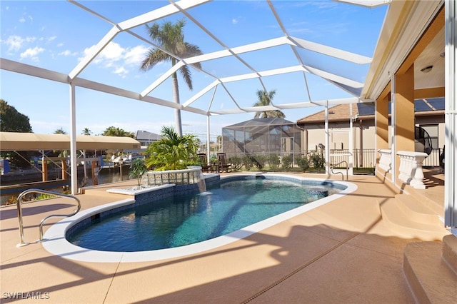 view of pool with a lanai and a patio