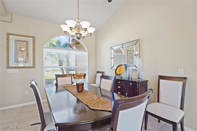 dining room featuring an inviting chandelier, lofted ceiling, and light tile patterned flooring