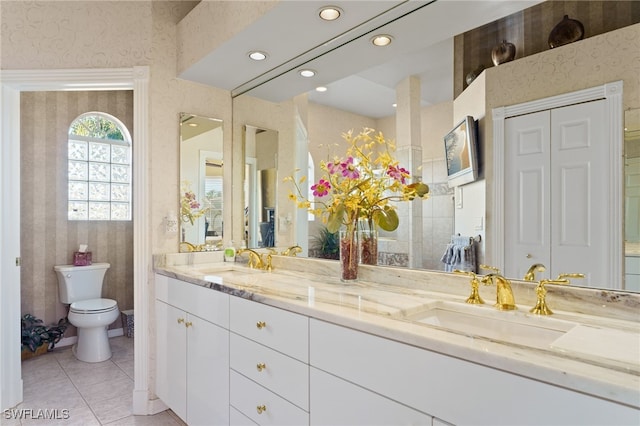 bathroom with tile patterned floors, vanity, and toilet