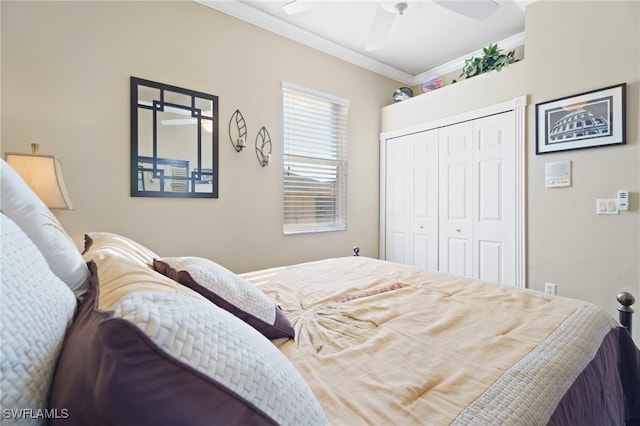 bedroom with ceiling fan, a closet, and crown molding