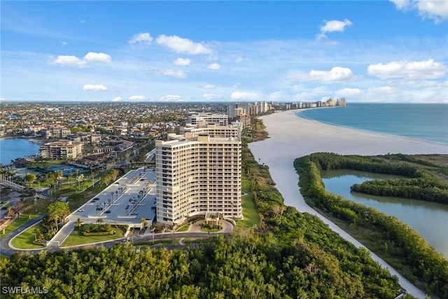 birds eye view of property featuring a water view and a view of the beach