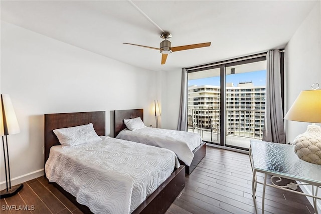 bedroom with ceiling fan, floor to ceiling windows, and access to outside