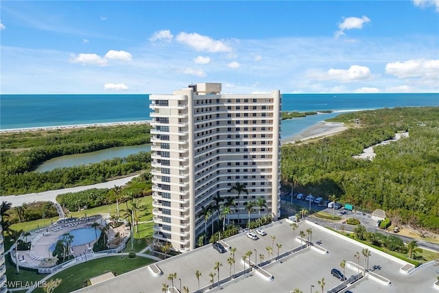 drone / aerial view featuring a view of the beach and a water view