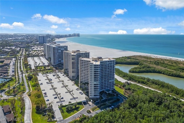 aerial view with a water view and a beach view