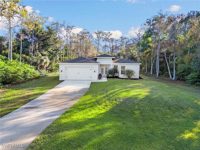 view of front of property with a garage and a front lawn