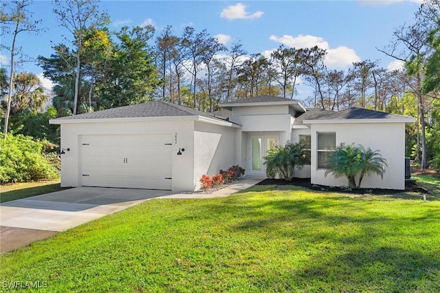 view of front of property featuring a garage and a front yard