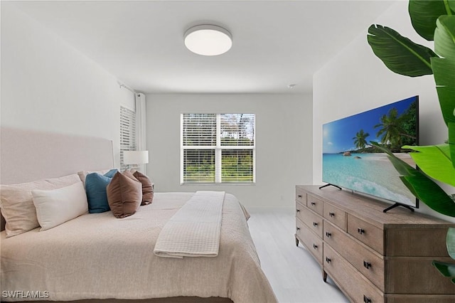 bedroom with light hardwood / wood-style floors