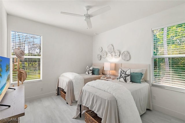 bedroom featuring ceiling fan and light hardwood / wood-style flooring