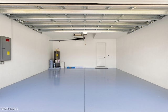 garage with electric panel and water heater