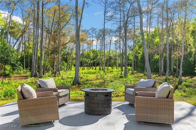 view of patio / terrace featuring an outdoor fire pit